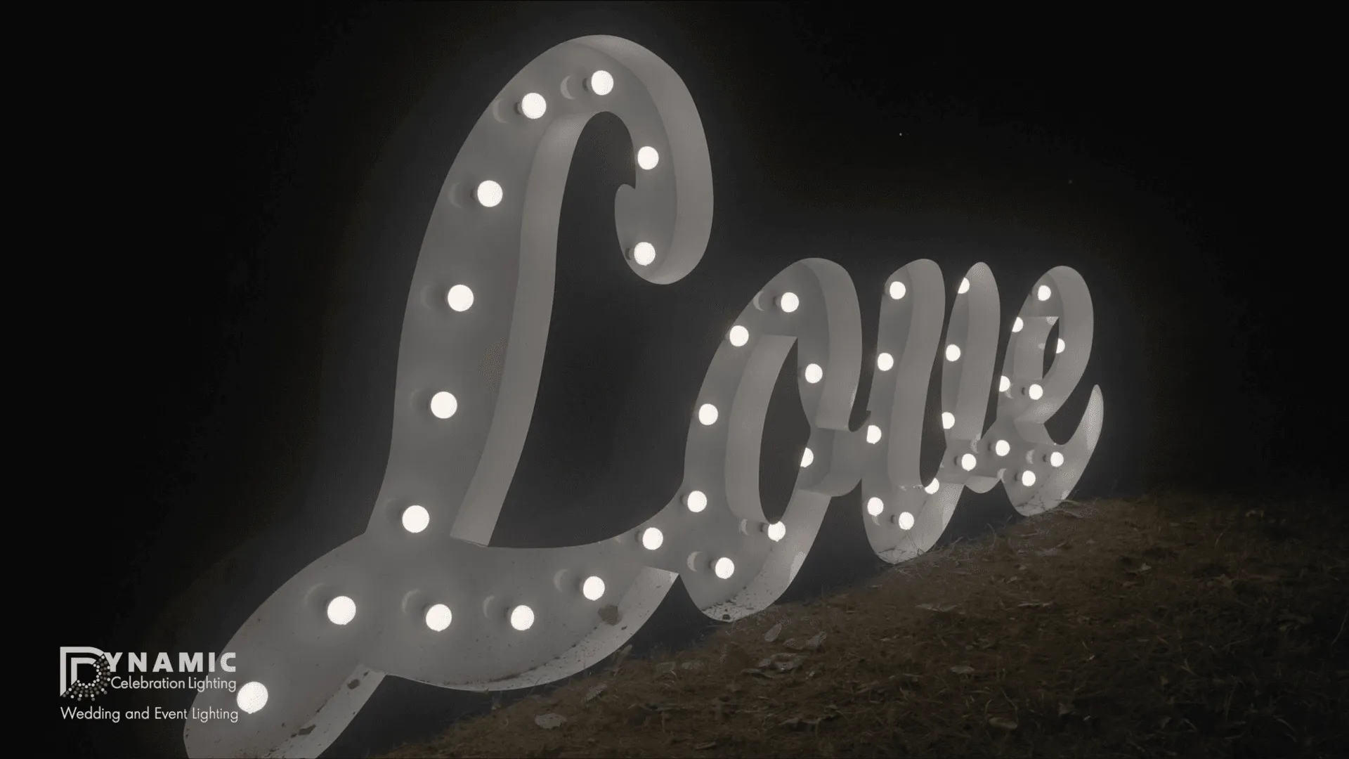 Large lit marquee letters used as a decorative sign at a wedding or event